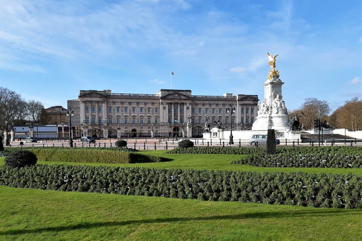 a castle on top of a grass covered field